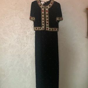 Hand sewn beaded black formal dress. Quality silk with bead work throughout.